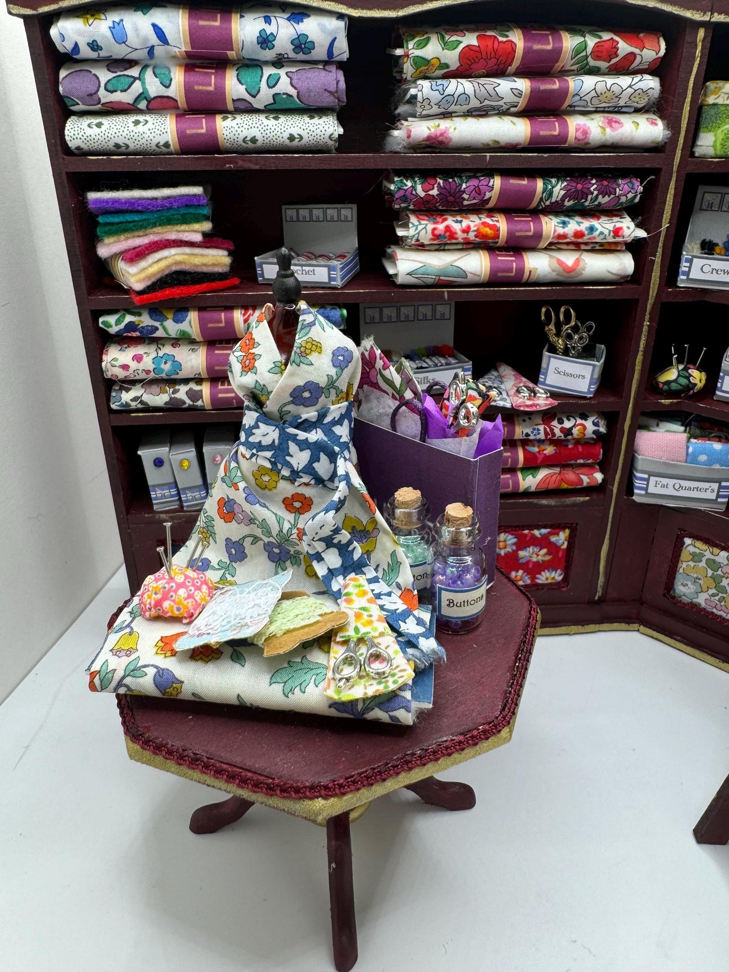 Dolls House Miniatures - 1/12th  Liberty fabric and Inspired Haberdashery Shop Shelves and display Table